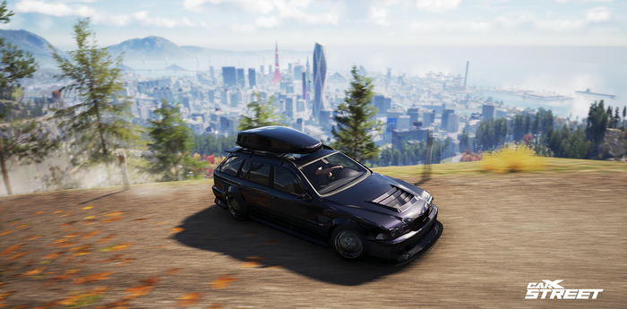 BMW wagon drifts in the mountains high above the city